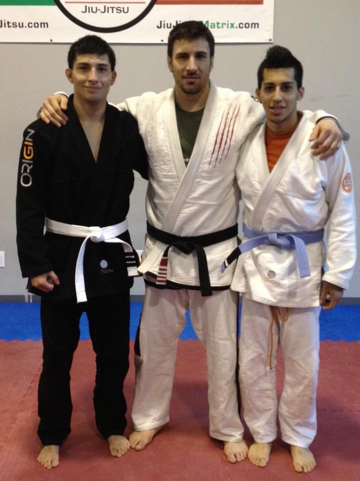 A young Ivan Perez in a gi with training partners in the early years of his jiu-jitsu journey